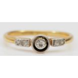 An Art Deco 18ct gold and platinum diamond set ring, L, 2gm