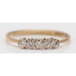 A vintage 9ct gold and brilliant cut diamond five stone ring, O 1/2, 1.1gm