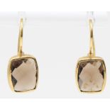 A 9ct gold mounted pair of multi facetted smokey quartz ear rings, stones 10 x 8mm, 2.1gm