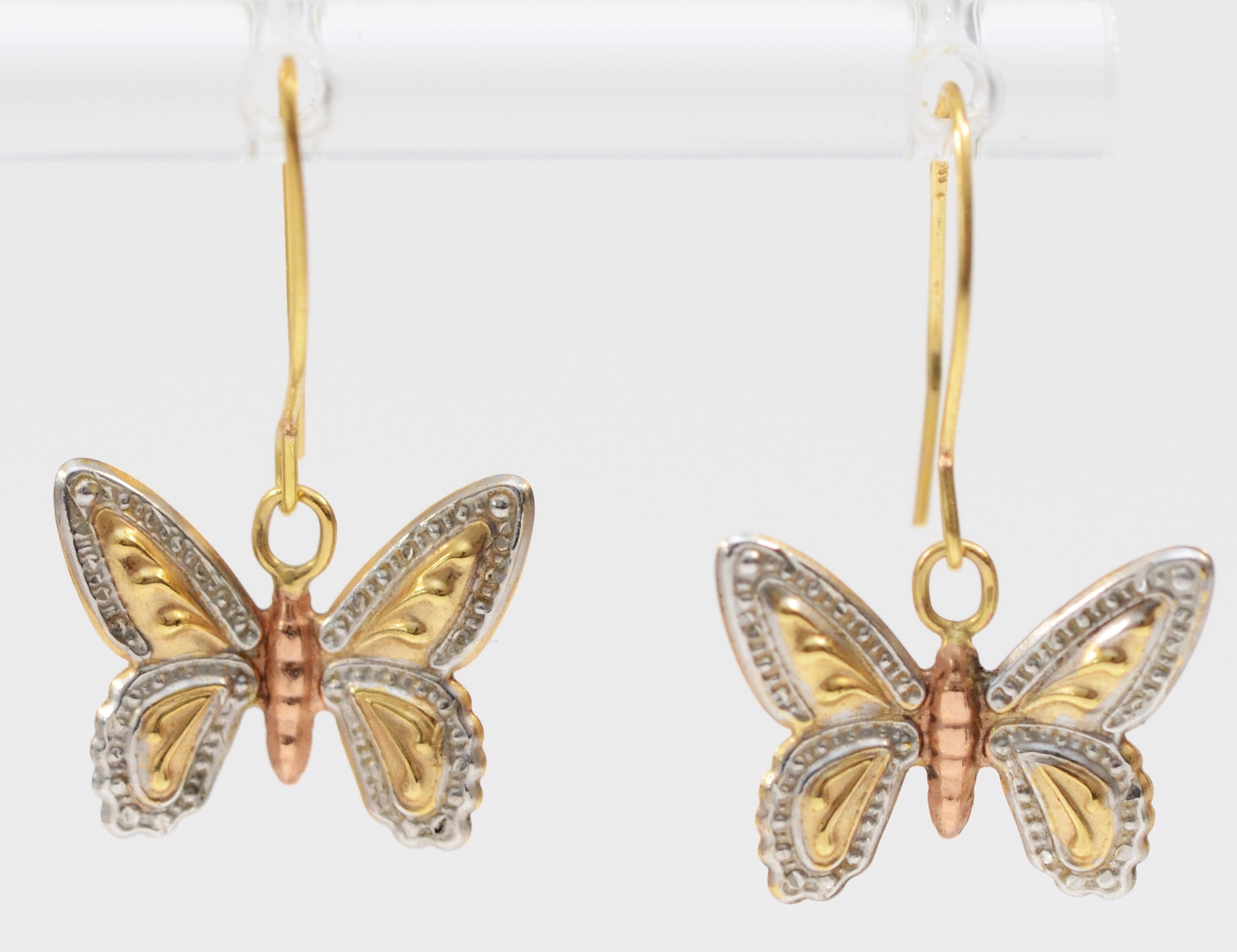 A pair of unmarked three colour gold butterfly ear pendants, 15 x 12mm, 0.5gm