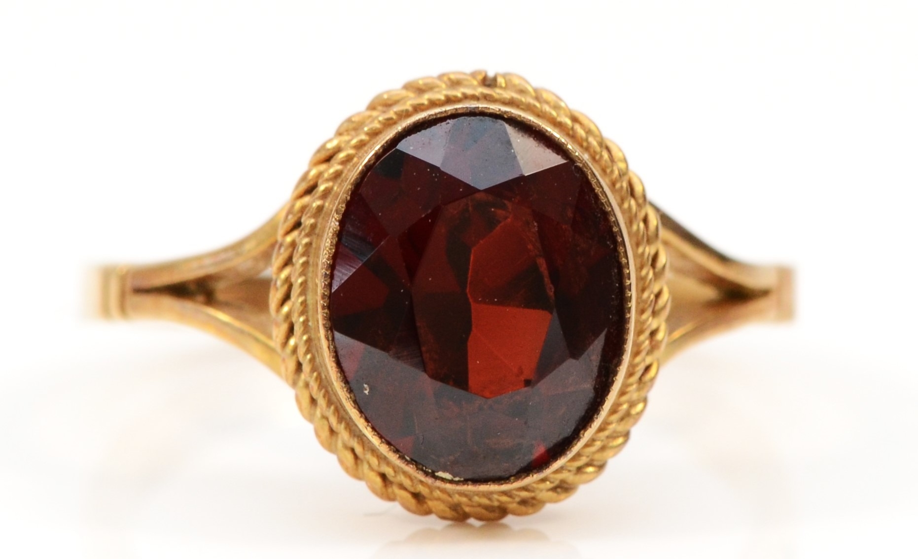 A 9ct gold and garnet single stone ring, stone 10 x 8mm, O 1/2, 2.9gm