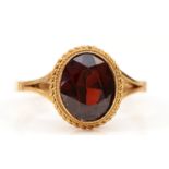 A 9ct gold and garnet single stone ring, stone 10 x 8mm, O 1/2, 2.9gm