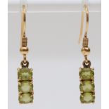 A 9ct gold pair of peridot ear pendants, 14mm, 2.5gm