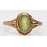 A 9ct gold and peridot dress ring, N 1/2, 1.4