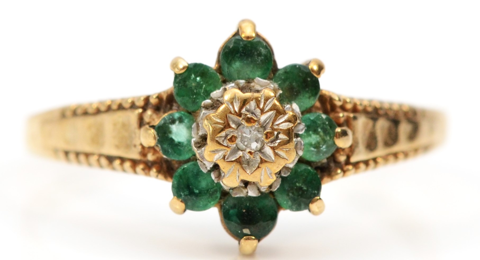 A 9ct gold emerald and diamond cluster ring, L, 1.6gm