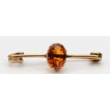 An unmarked Victorian rose gold and citrine bar brooch, 36mm, 2.4gm
