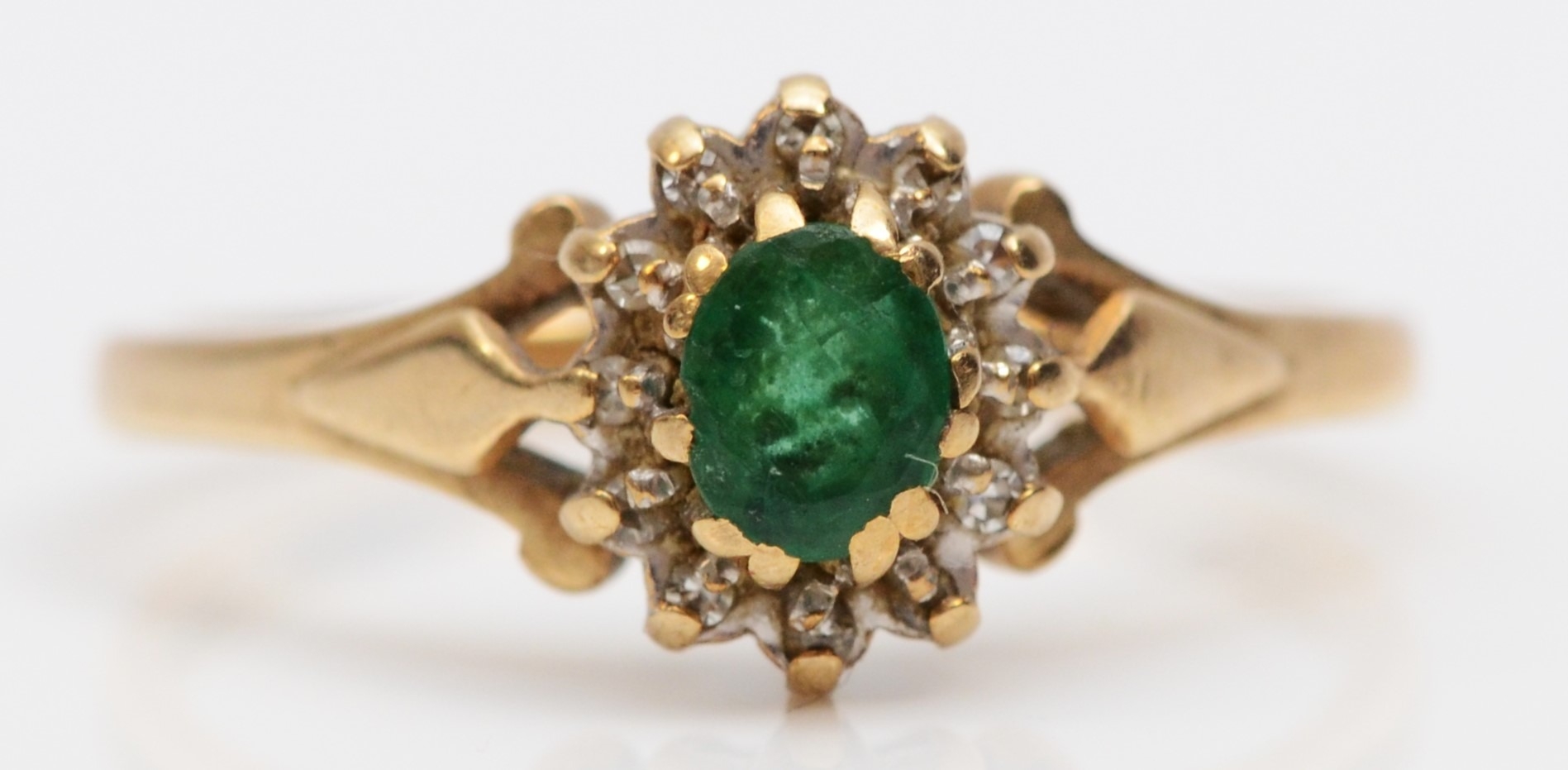 A 9ct gold emerald and diamond cluster ring, R, 2.5gm