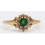 A 9ct gold emerald and diamond cluster ring, R, 2.5gm
