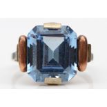 A vintage two colour gold, tests as 9ct, emerald cut blue stone dress ring 12 x 10mm, J, 3.3gm