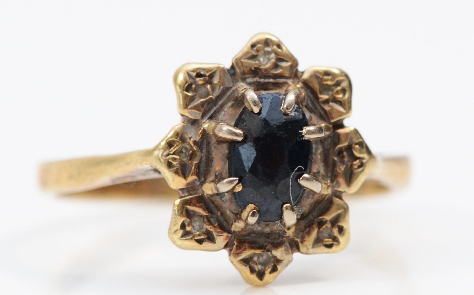 A 9ct gold sapphire and diamond cluster ring, L, 2gm