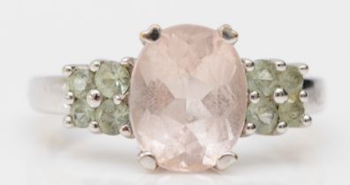 A 9ct white gold morganite and pale green gemstone dress ring, O, 3.7gm