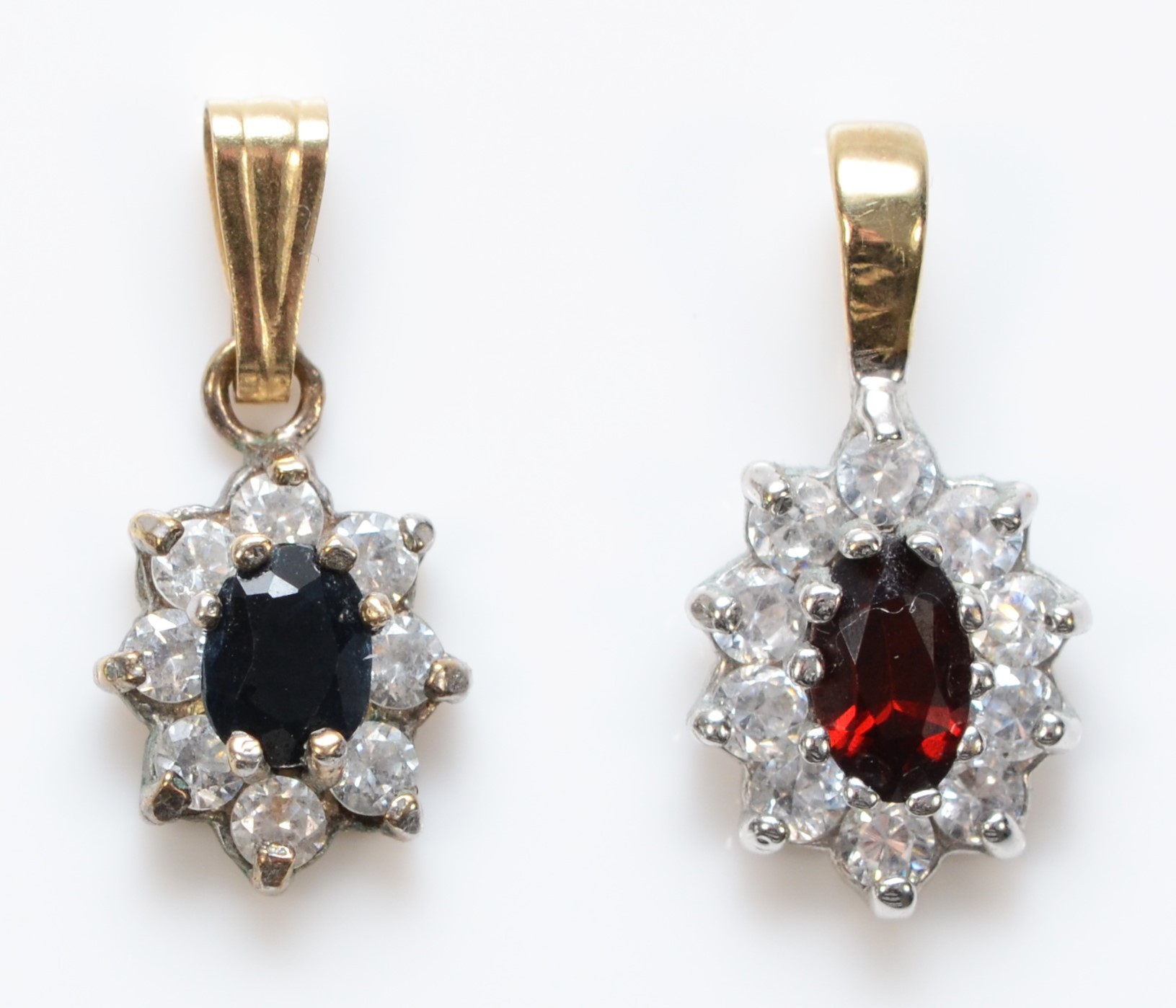 A 9K sapphire and white stone cluster pendant14mm and a garnet and white stone cluster pendant, 1.