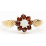 A 9ct gold opal and garnet cluster ring, Q, 1.9gm