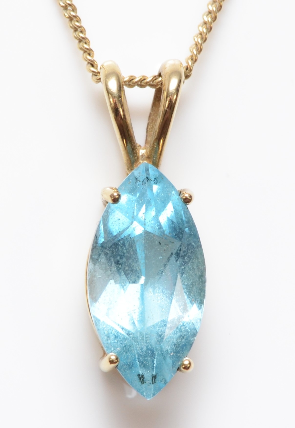 A 9ct gold and topaz pendant, stone 14 x 7mm, chain, 3gm