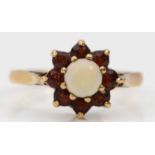 A 9ct gold opal and garnet cluster ring, M, 2.1gm