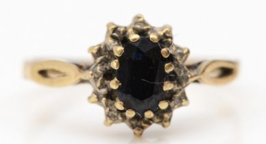 A 9ct gold sapphire and diamond cluster ring, L, 1.4gm