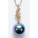 A 9ct gold, 9mm imitation pearl and white stone pendant, chain, 2.6gm