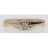 A vintage 9ct gold and platinum brilliant cut diamond single stone ring, M 1/2, 2gm