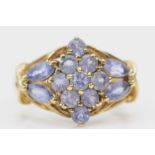 A 9ct gold and tanzanite cluster ring, O, 3.8gm