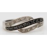 A 9ct white gold enhanced black diamond and diamond dress ring, P 1/2, 2.5gm