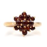 A 9ct gold and garnet cluster ring, L, 2.4gm.