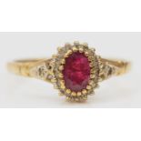 A 9ct gold ruby and diamond cluster ring, S, 2.4gm