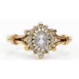 A 9ct gold pale blue and diamond cluster ring, M, 2.4gm