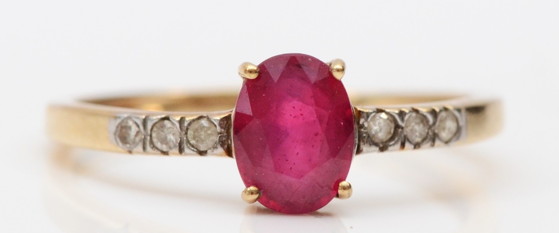 A 9ct gold, red gemstone and diamond ring, N, 1.3gm