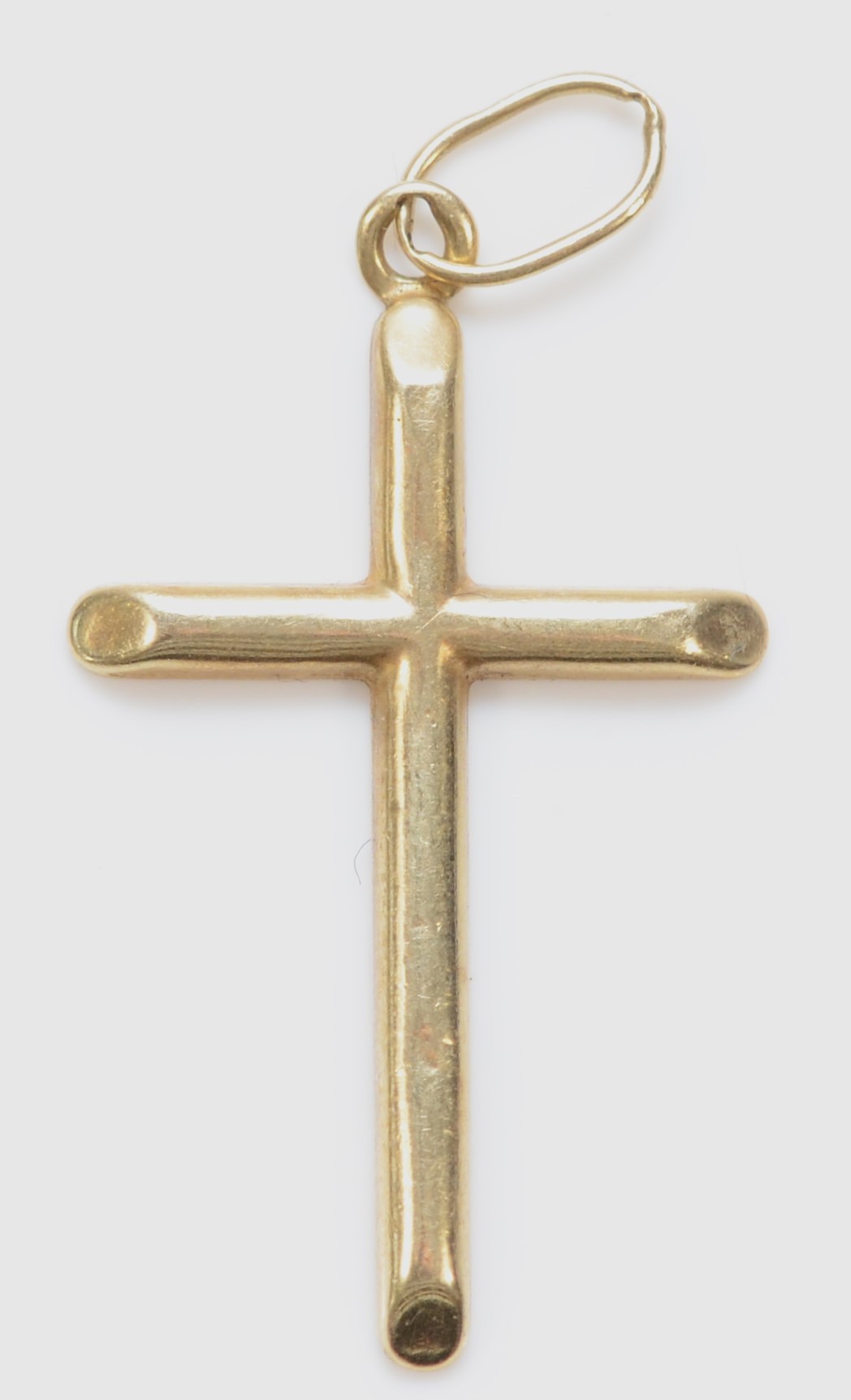 A 585 gold cross pendant, top loop stamped, 30 x 17mm, 0.9gm