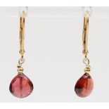 A 9ct gold mounted pair of facetted garnet ear pendants, 8 x 8mm, 1.6gm