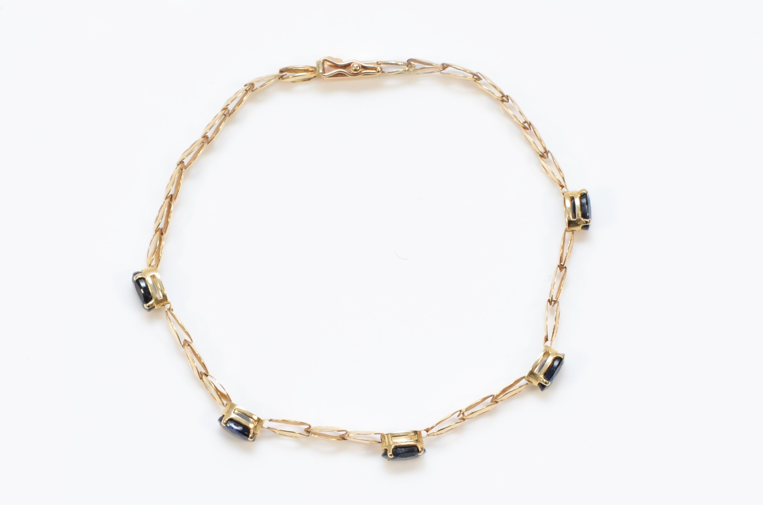 A 9ct gold and sapphire set line bracelet, 17.5cm, 2.9gm - Image 2 of 2