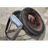 A vintage 19" wire wheel, two chrome wire wheels, 5 1/2Kx 15 x 22 and a radiator grill surround