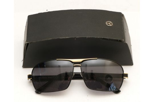 A pair of Mercedes Benz branded sunglasses, serial no. MB722 65 12-142, complete with case. - Image 1 of 2