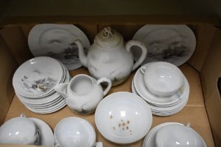 A Japanese egg shell tea service, decorated with traditional subject matter