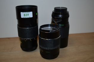 Three Chinon lenses. A 1:2,8 135mm and two Auto 1:3,5 200mm