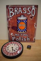 A contemporary Brasso Metal Polish advertising sign, a novelty St Etienne Chocolat wall clock, and