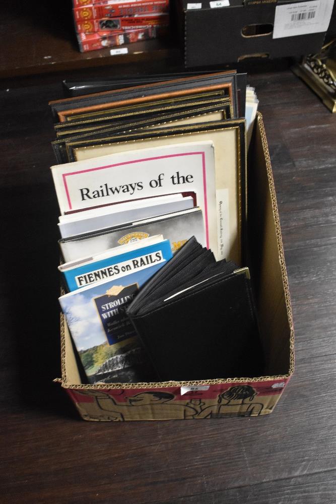 A box of reading material, including 'Strolling With Steam', 'A History of the LMS', and other