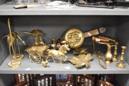 An assortment of brass studies, pin dishes, trivet, bellows to be included.