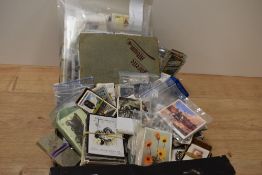 A box of assorted cigarette cards, of botanical and automobilia themes, plus other subject matter