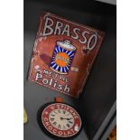 A contemporary Brasso Metal Polish advertising sign, a novelty St Etienne Chocolat wall clock, and