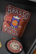 A contemporary Brasso Metal Polish advertising sign, a novelty St Etienne Chocolat wall clock, and