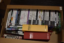 A box of Playstation 2, Xbox, Wii, and PC computer games, plus books on Edgar Reitz's Heimar film