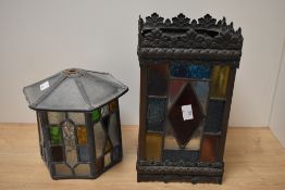 Two antique stained glass lamp shades, one of hexagonal form and the other rectangular.