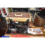 A Singer sewing machine, model number K8778454, with case.