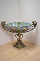A reproduction Art Nouveau style moulded metal centre piece, having ceramic liner with floral