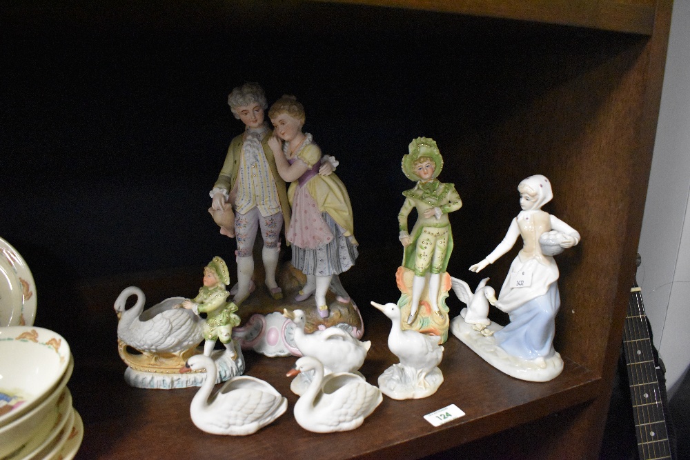 A 19th Century continental bisque porcelain figure group, with impressed number to the base,