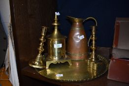 A 19th Century copper and brass pitcher, measuring 24cm tall, a pair of candlesticks, a brass