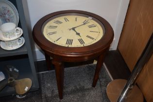 A stained wood coffee table, having working clock face under glass with quartz movement. approx