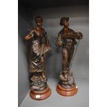 Two late 19th century cast metal bronzed effect figurines sat on wooden bases, depicting a male