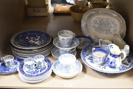 A variety of blue and white ware, including coffee cans, plates, jugs and cups and saucers.